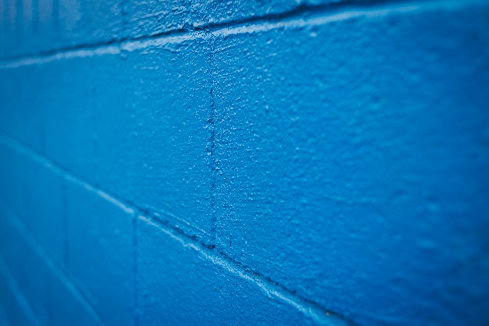 blue concrete wall during daytime