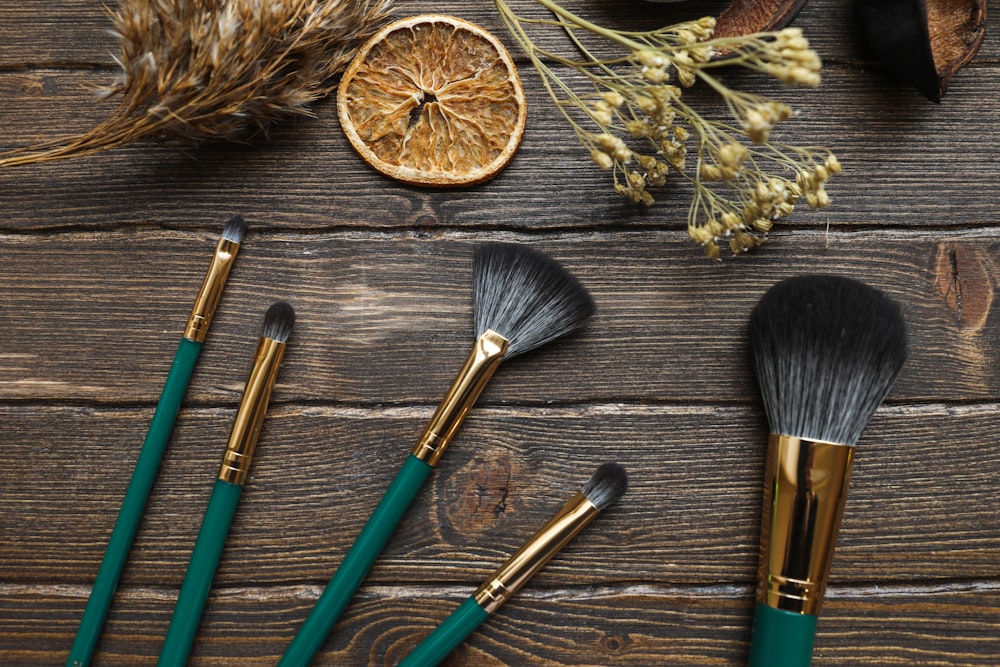 green and brown makeup brushes