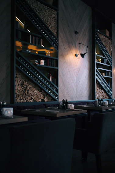 A warm, inviting Scandinavian-style restaurant corner with wooden tables and soft lighting highlighting fresh, artisanal dishes.