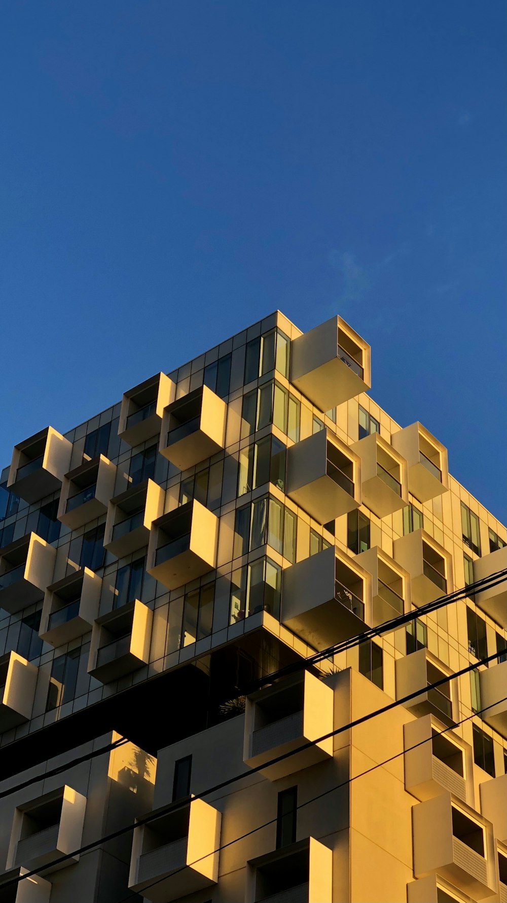 white concrete building under blue sky during daytime