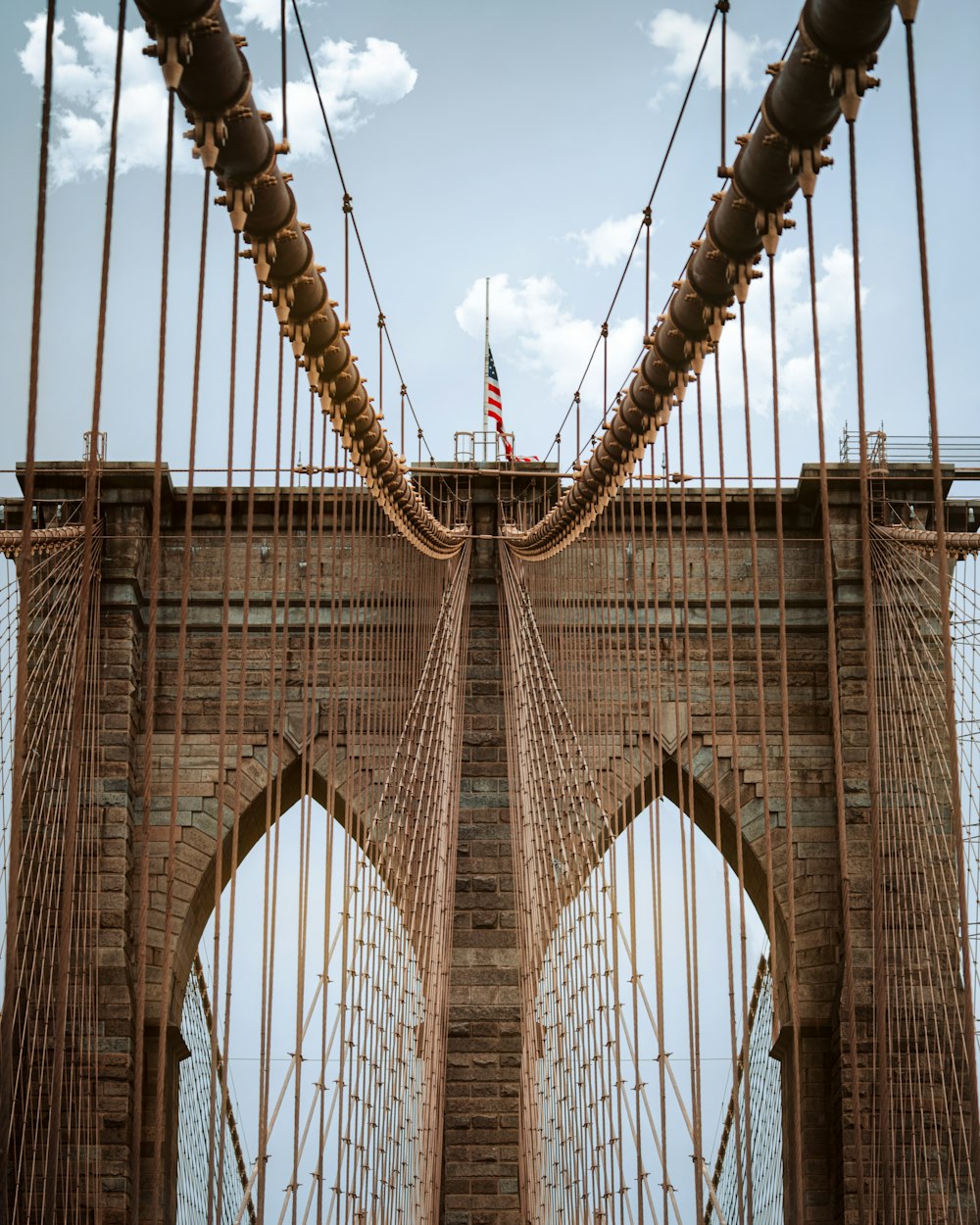 brown bridge under blue sky during daytime