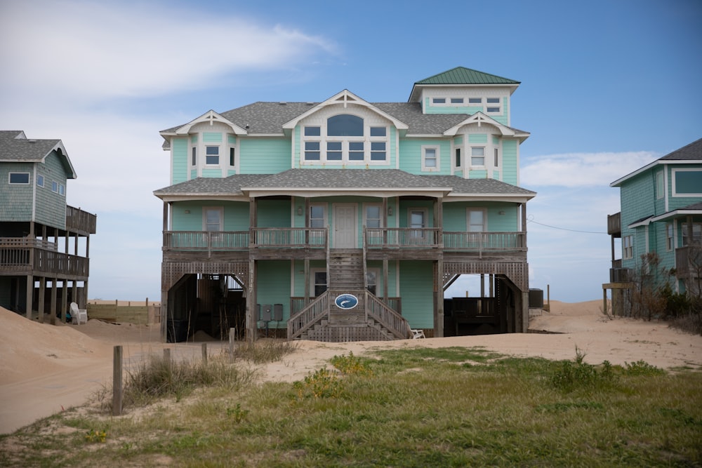 white and blue concrete house under blue sky during daytime