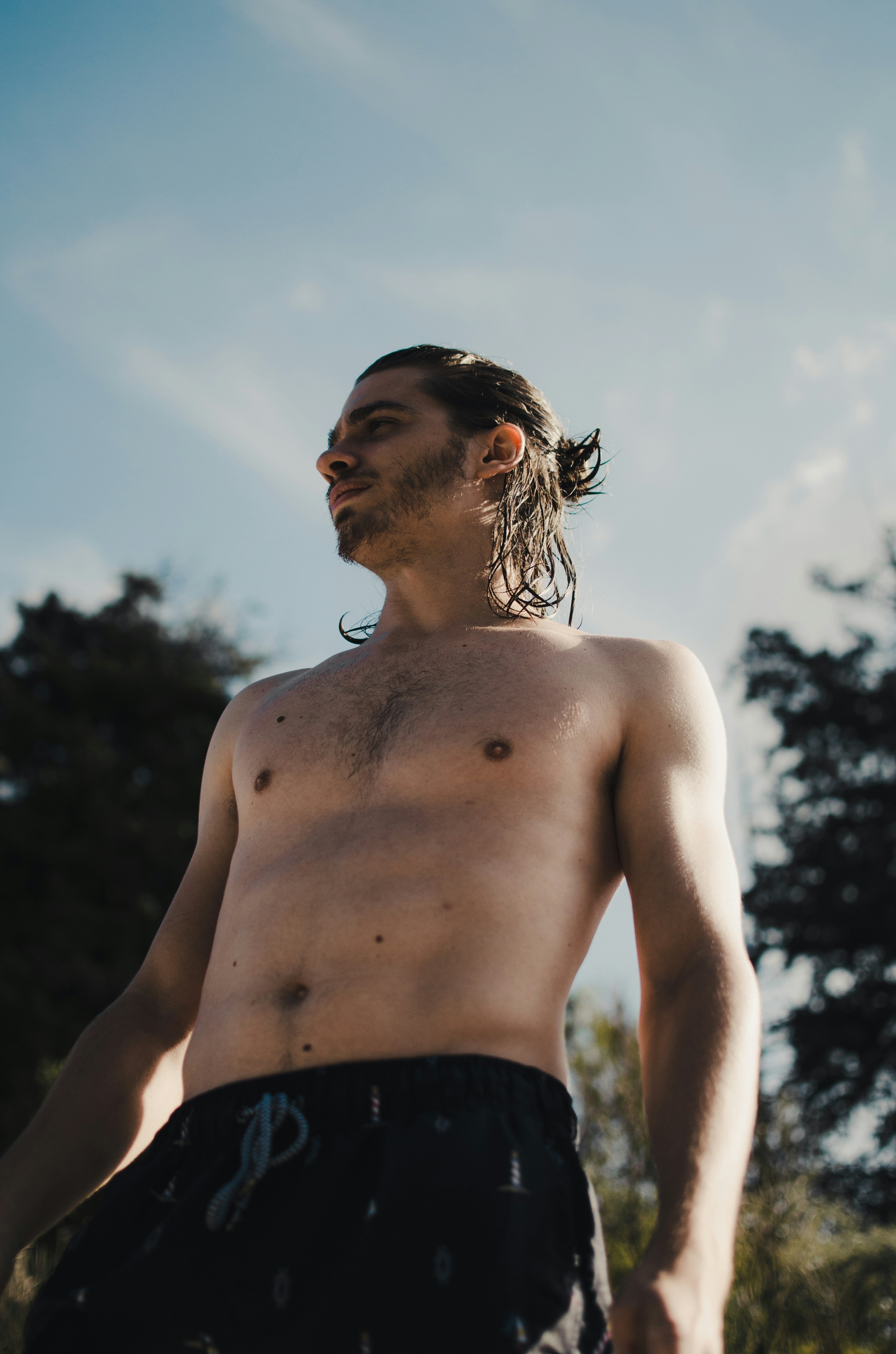 topless woman in black bottoms