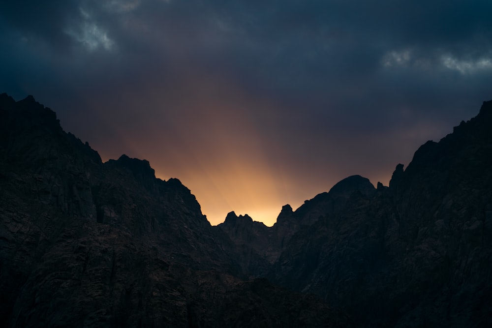 silhouette of mountain during sunset