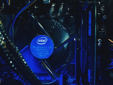 Close-up of a high-performance Intel processor glowing with electric blue accents on a dark metallic background
