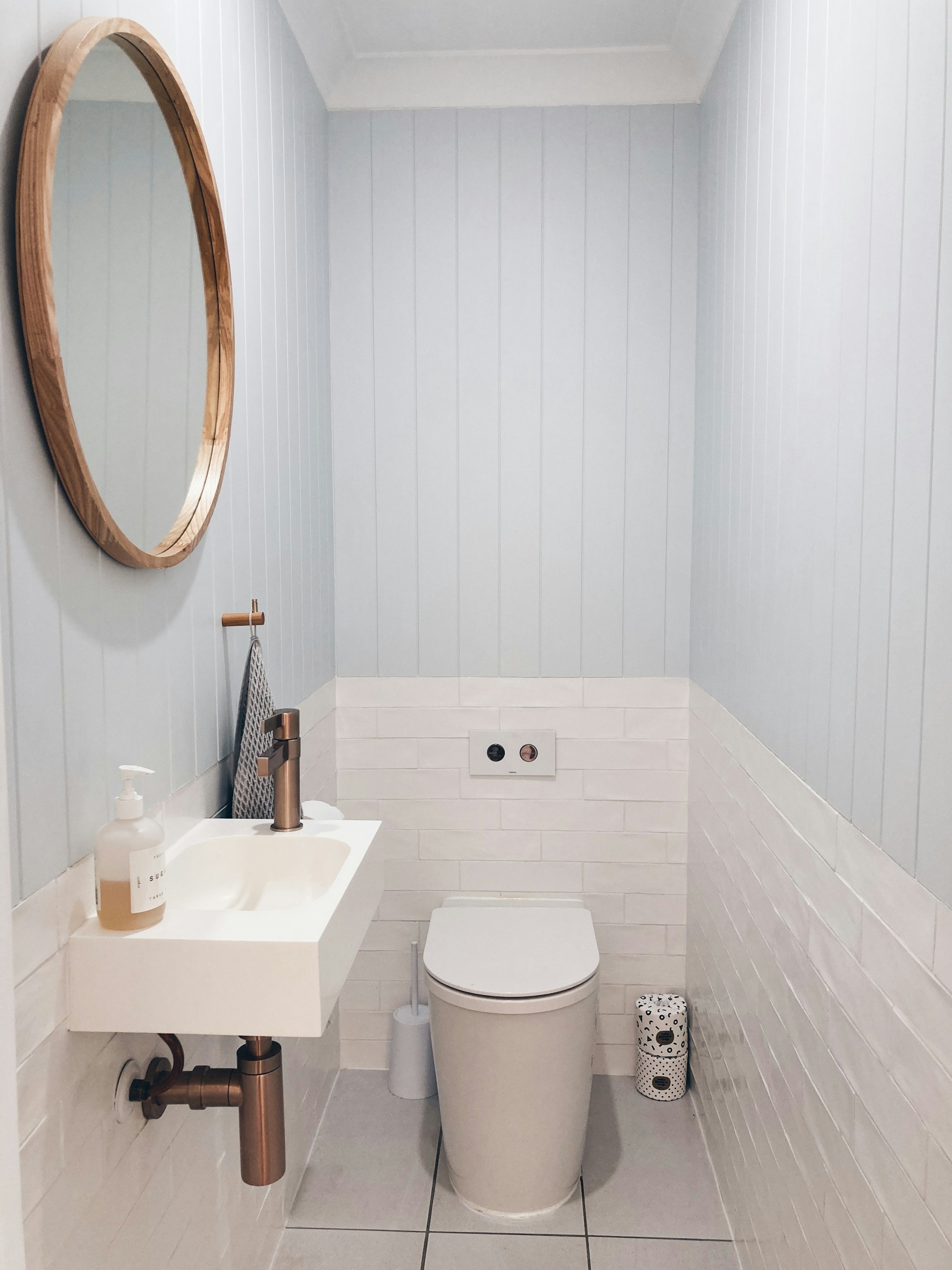 white ceramic sink with stainless steel faucet