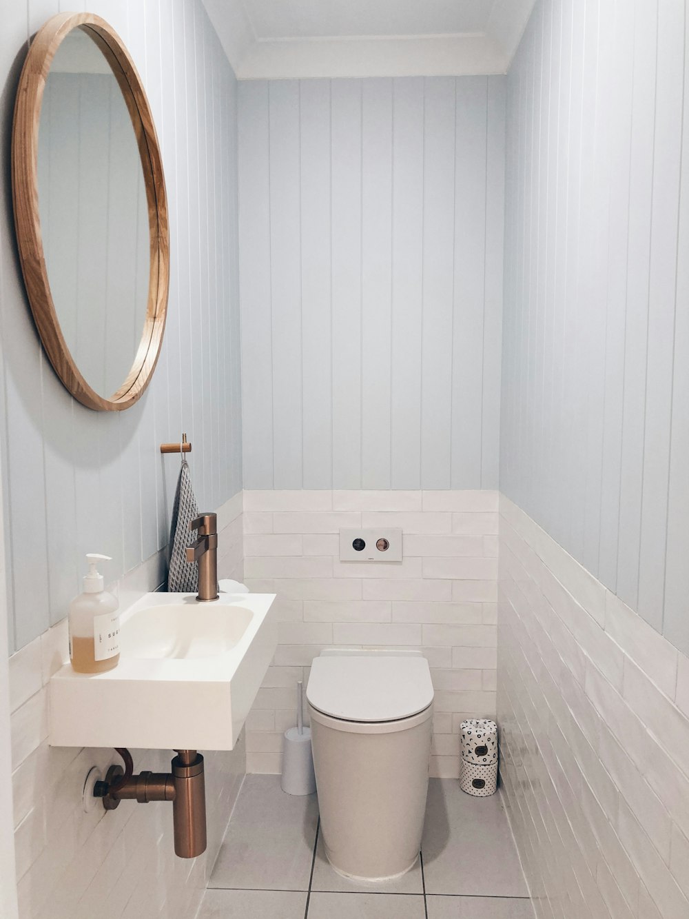 white ceramic sink with stainless steel faucet