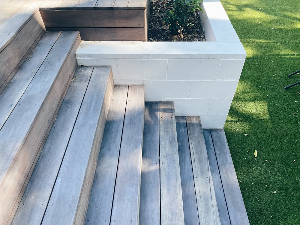 brown wooden stairs near green grass during daytime