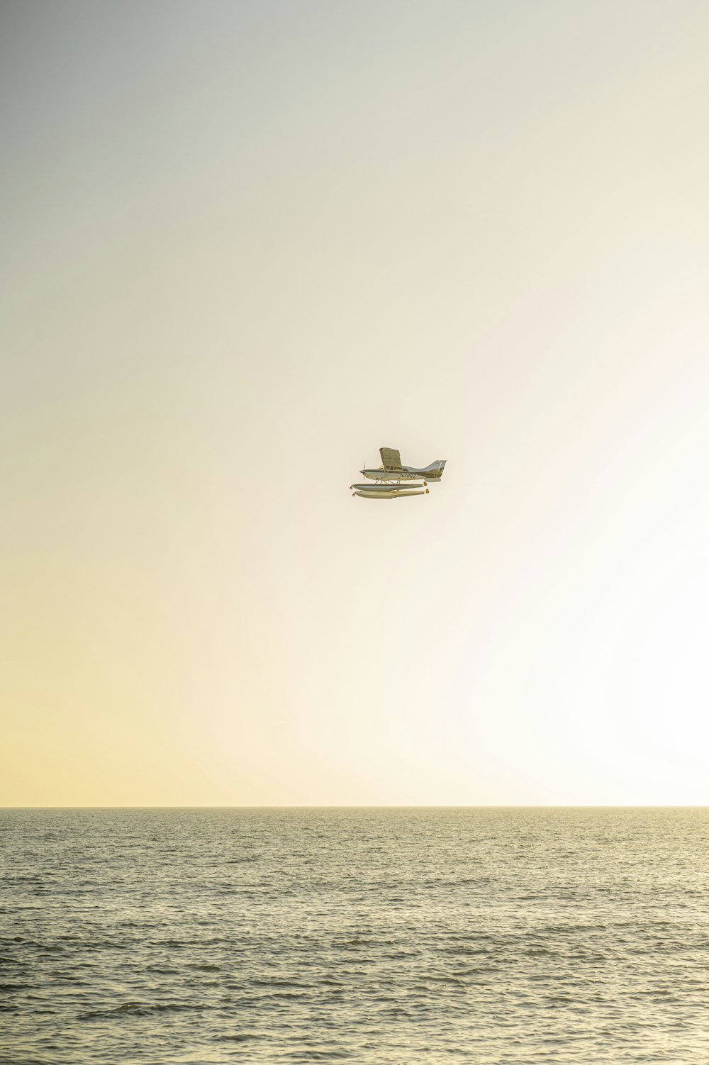 white and black boat on sea during daytime