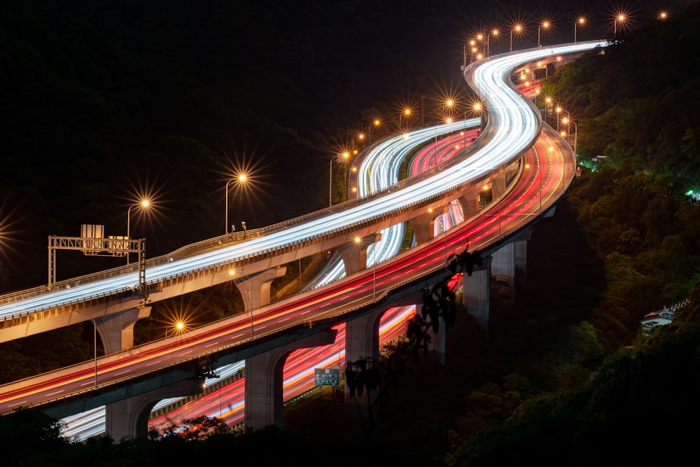 time lapse photography of cars on road during night time