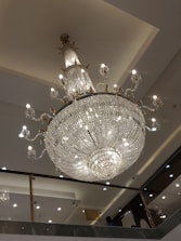 A stunning chandelier illuminating a modern dining area.