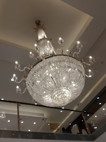 A stunning chandelier illuminating a modern dining area.