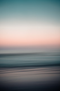 body of water under cloudy sky during daytime