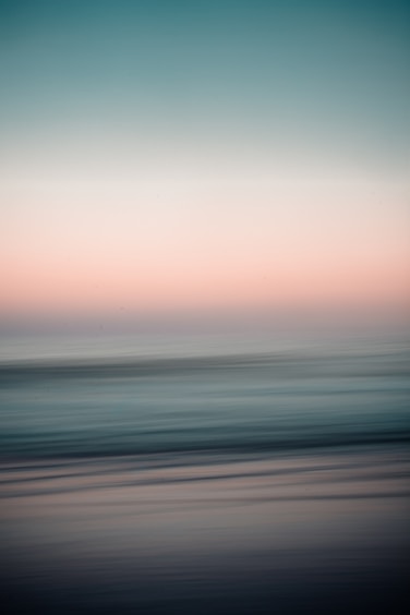 body of water under cloudy sky during daytime