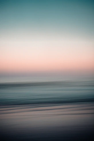 body of water under cloudy sky during daytime