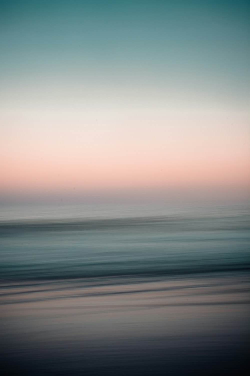 body of water under cloudy sky during daytime