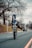 man in black jacket riding bicycle on road during daytime