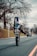 man in black jacket riding bicycle on road during daytime