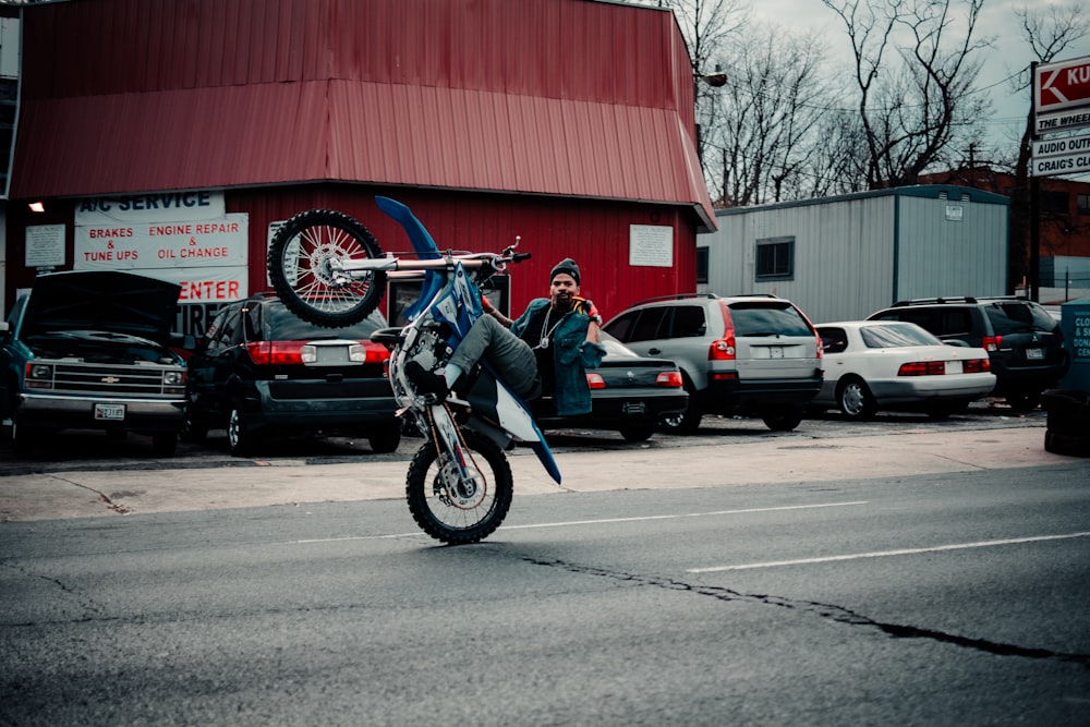 man riding motorcycle on road during daytime