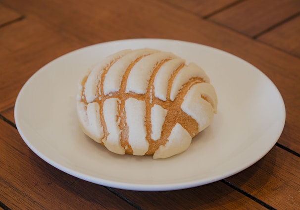 white ceramic plate with brown and white bread