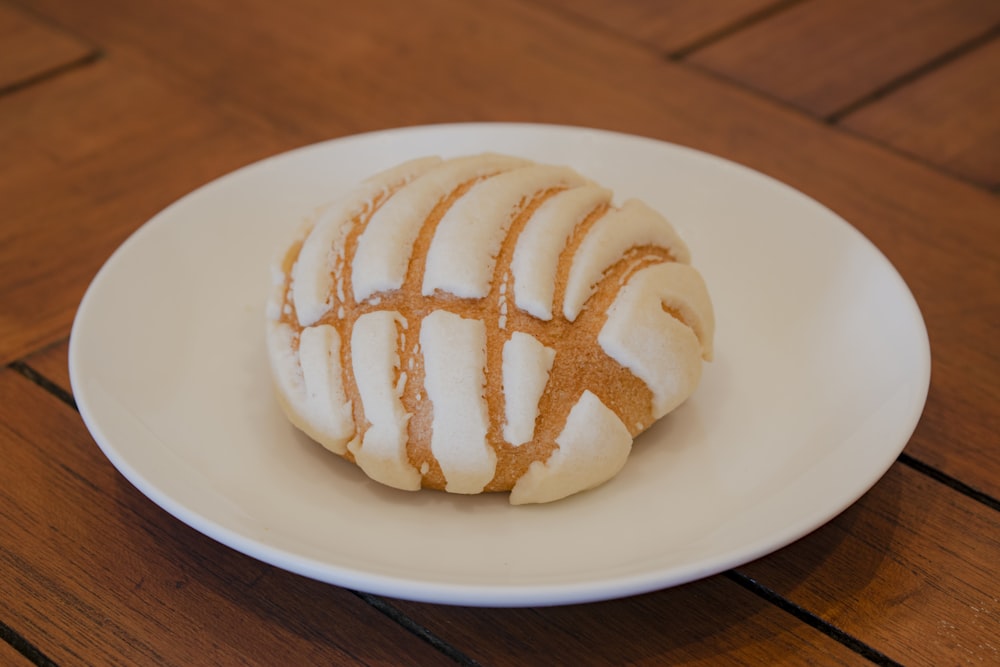 white ceramic plate with brown and white bread