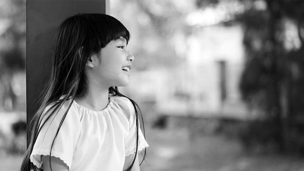 woman in white shirt with black sling bag