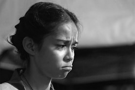 A patient reviewing a health insurance denial letter with a concerned expression