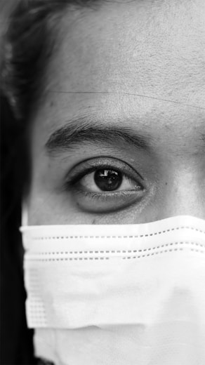 grayscale photo of persons eye