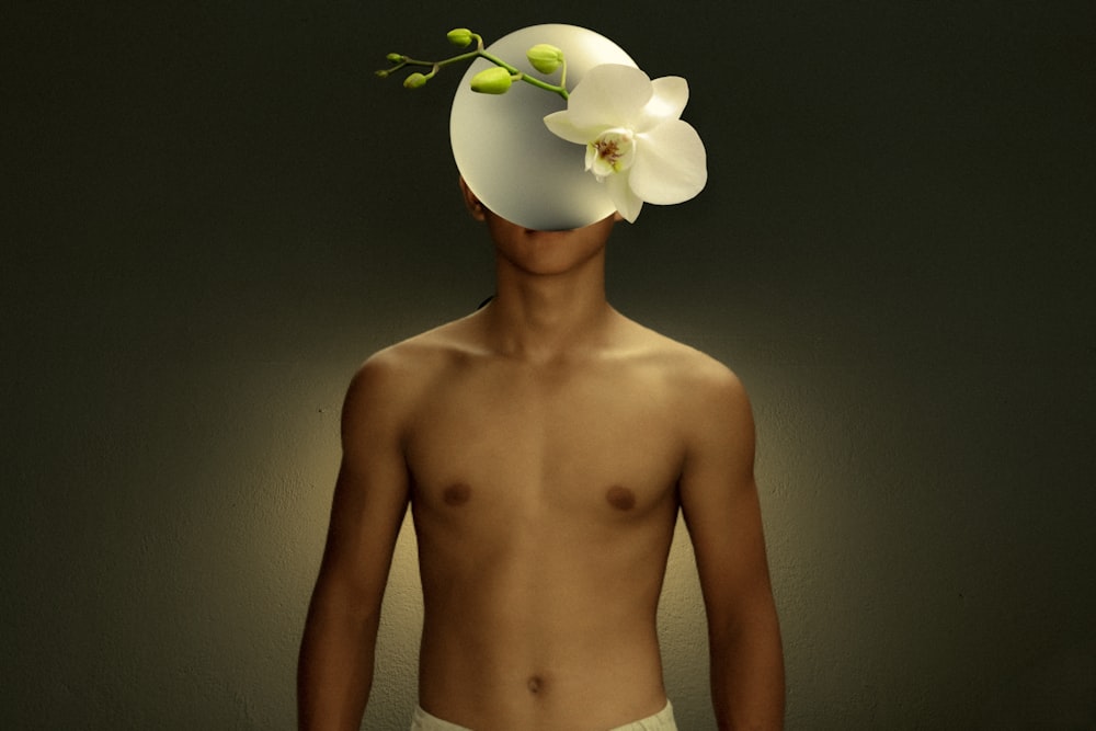topless woman with white flower on her ear