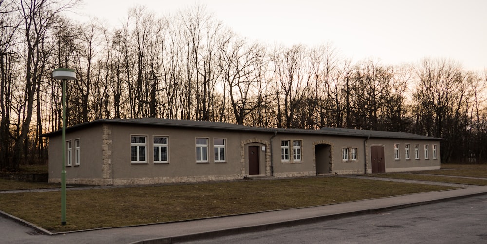 white concrete building near trees during daytime