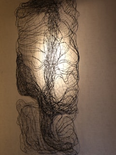 An abstract installation representing human–machine epistemology through layered transparent panels.