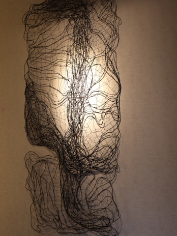 An abstract installation capturing light and shadow to evoke a sense of invisible luxury.