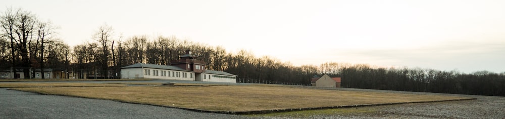 white and brown house near green grass field