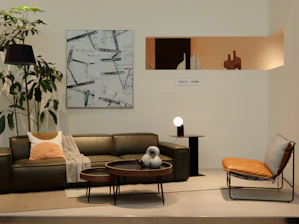 brown wooden round table near brown padded chair