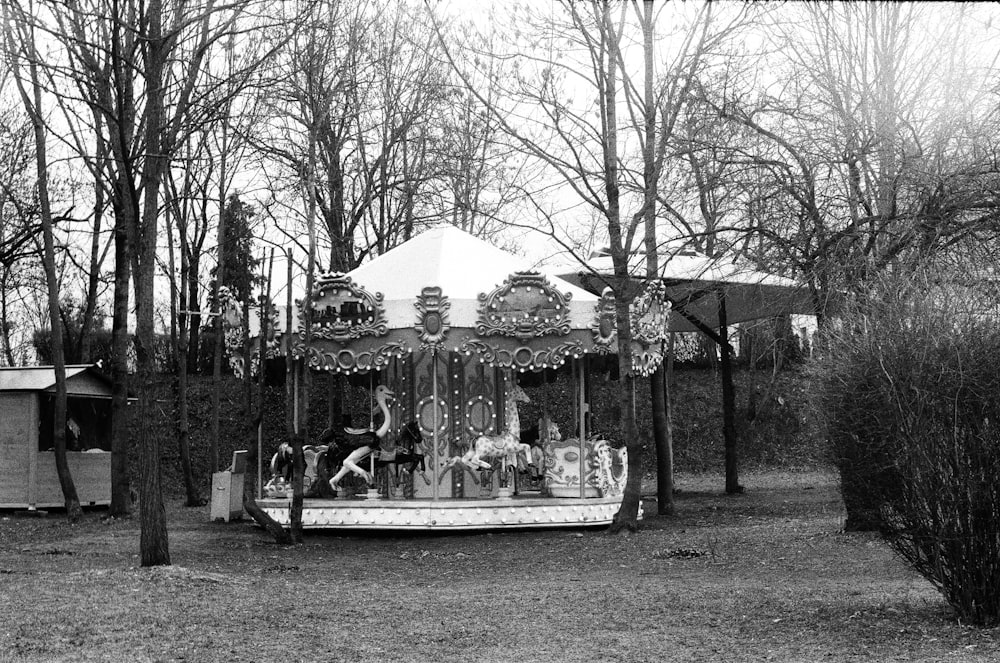grayscale photo of carousel in park