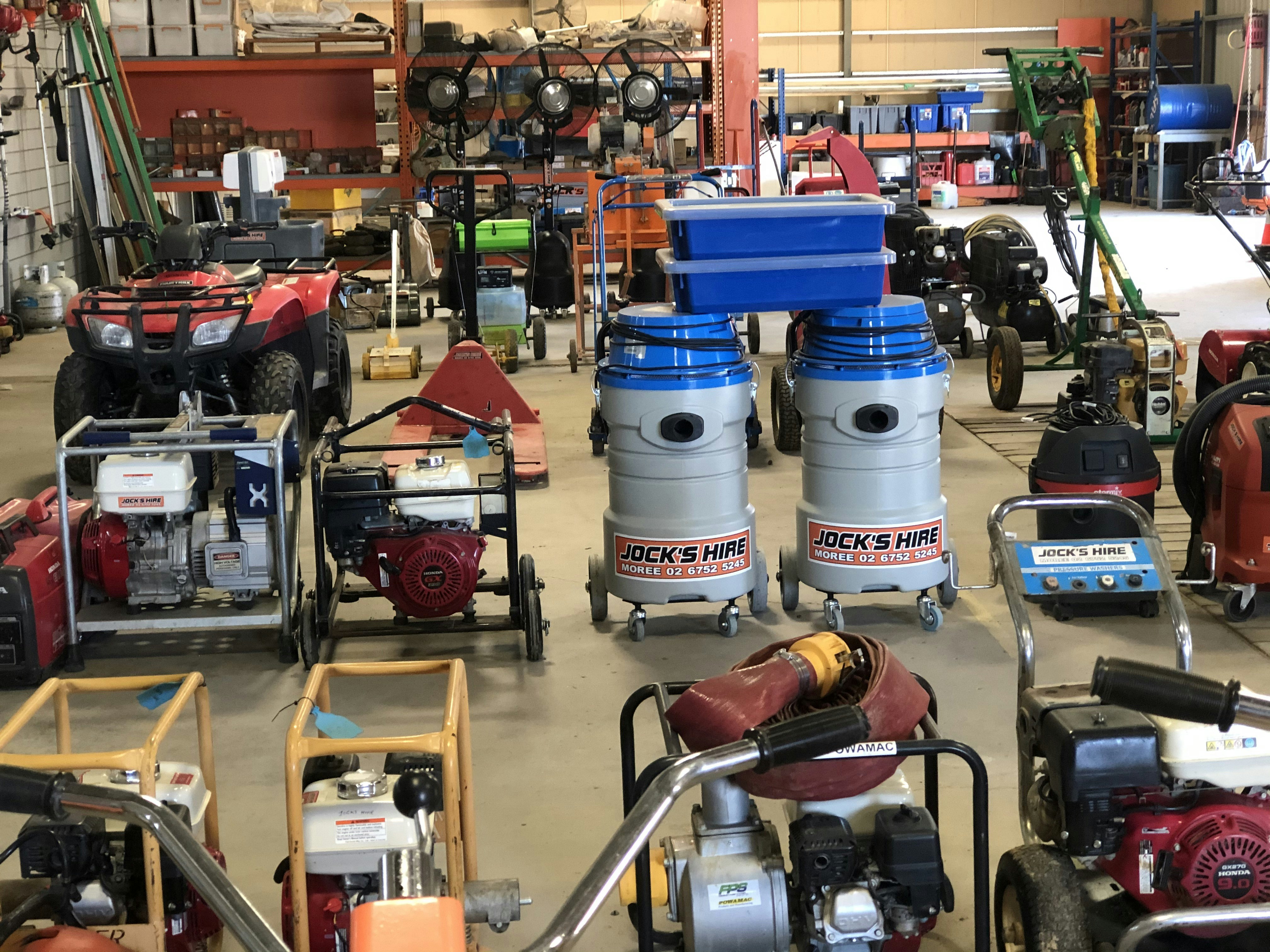 Outdoor power equipment inventory at Palm Beach County Mowers including generators and pressure washers