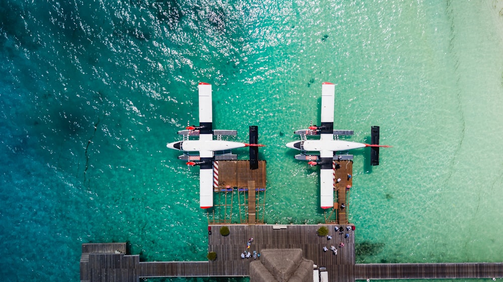 aerial view of white and red boat on sea during daytime