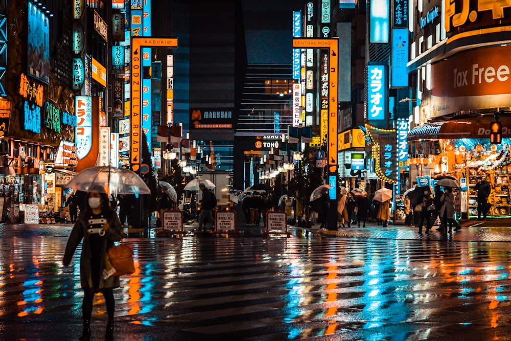 people walking on street during night time