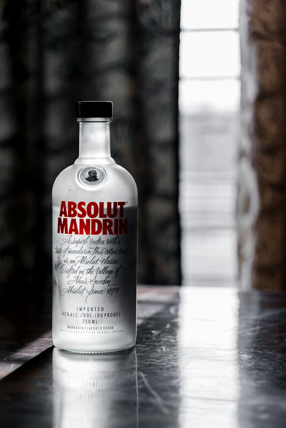 a bottle of absolut mandarin on a table