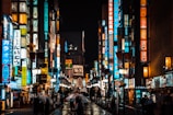 people walking on street during night time