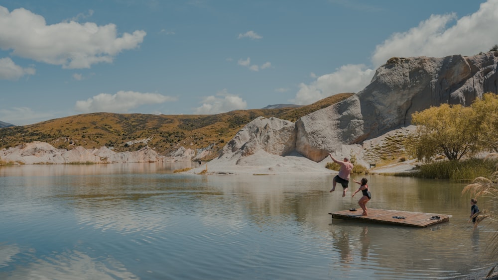 people riding on boat on lake during daytime