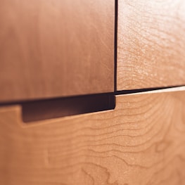 Close-up of detailed wood grain and smooth finish on a bespoke MDF drawer.