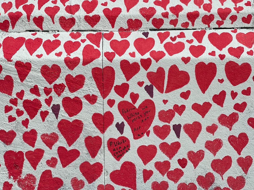 red and white heart print textile