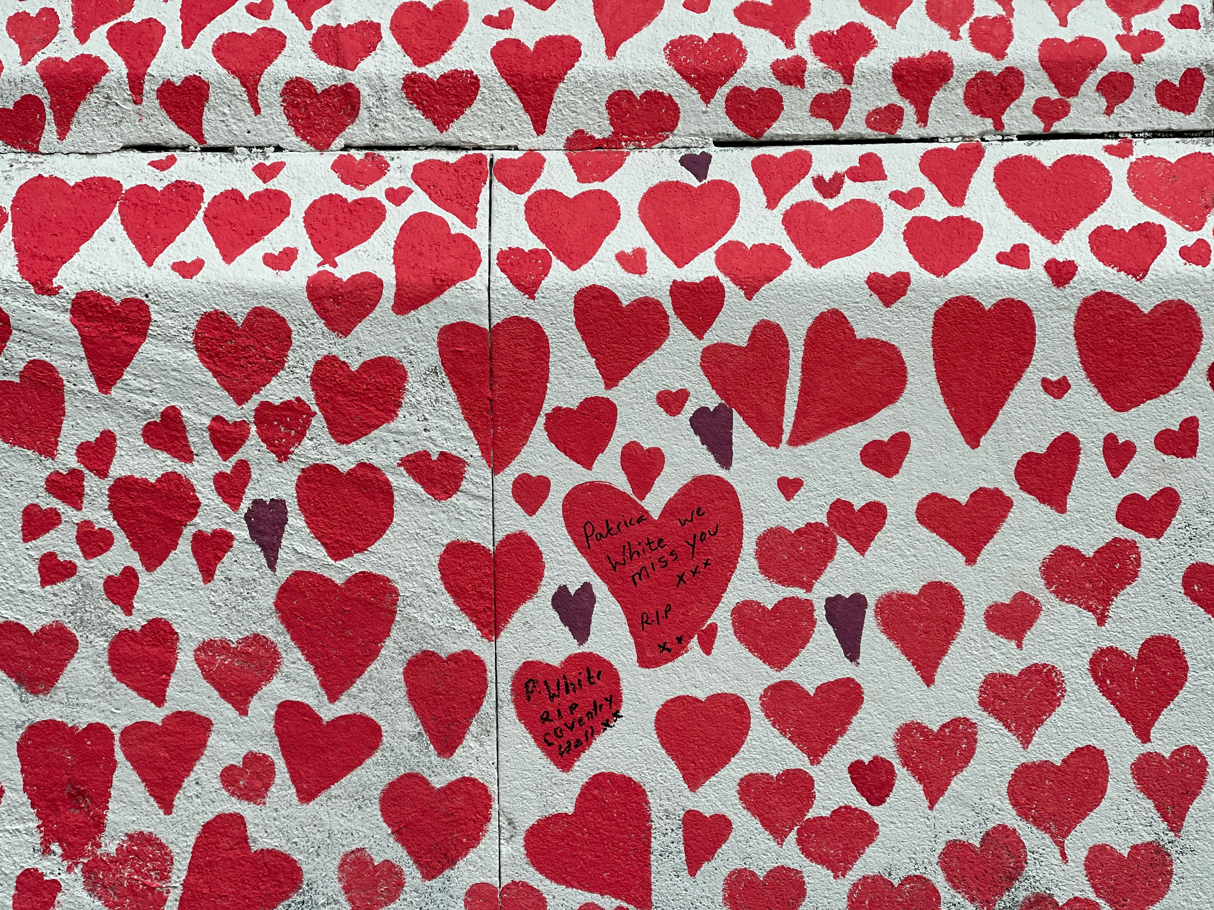 red and white heart print textile