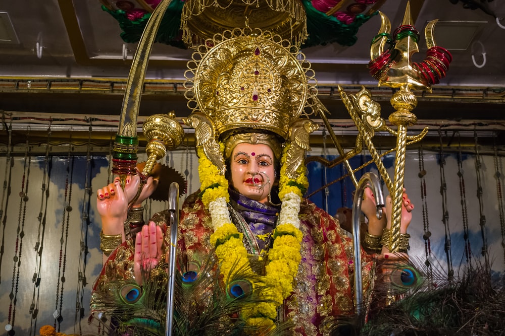 woman in gold and blue floral costume