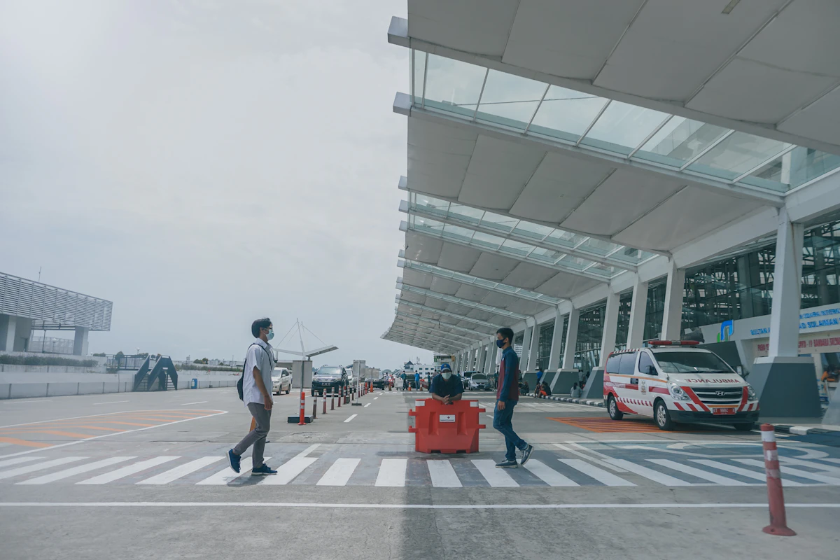 Travelers passing through international airport border control checkpoint