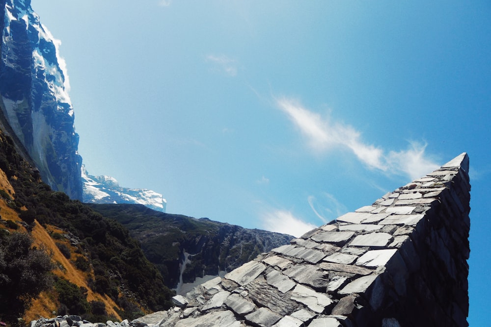 gray rocky mountain under blue sky during daytime