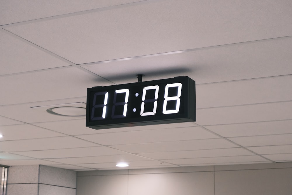 black and white digital clock at 11 00