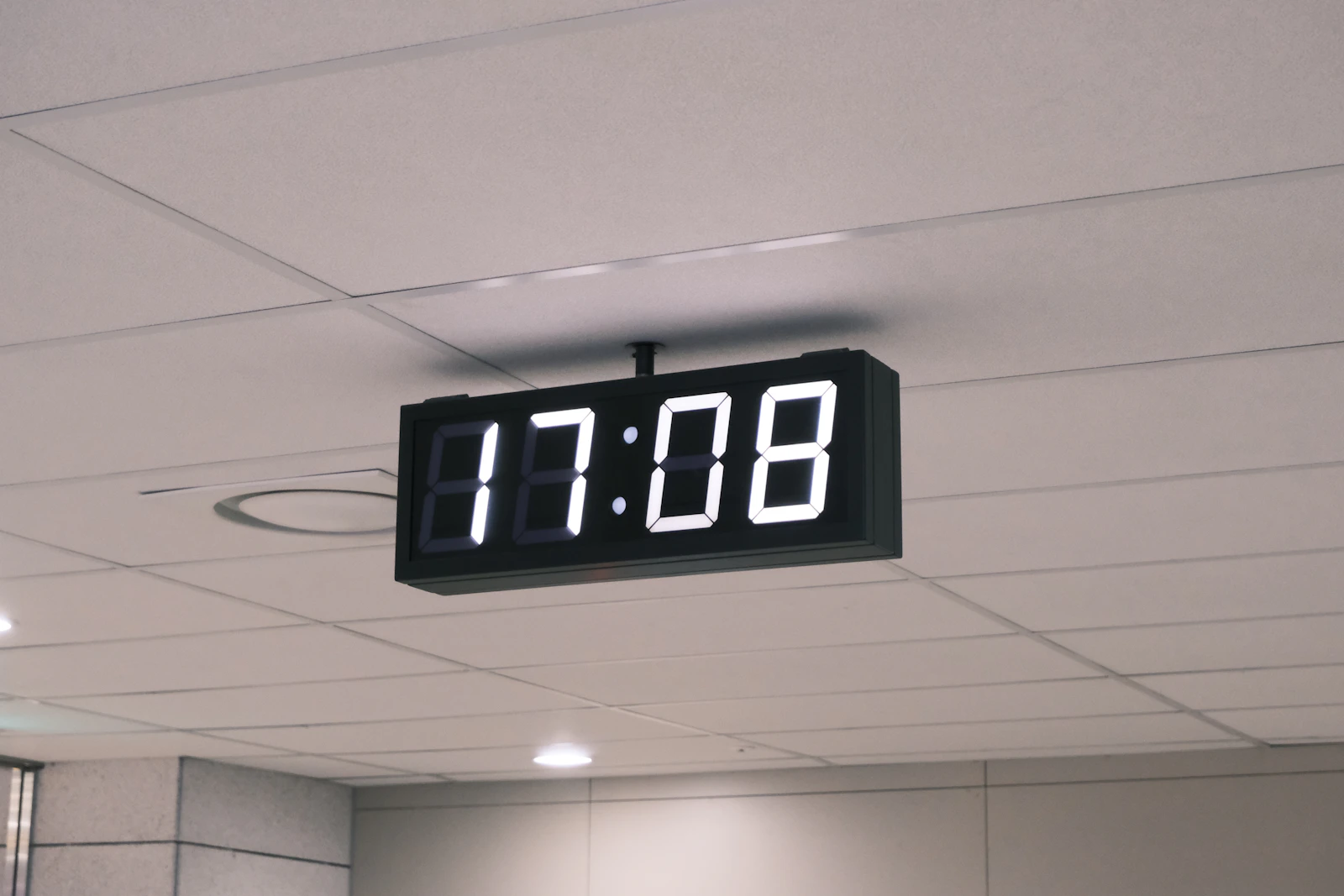 A black digital clock display against a dark background, evoking a countdown running out