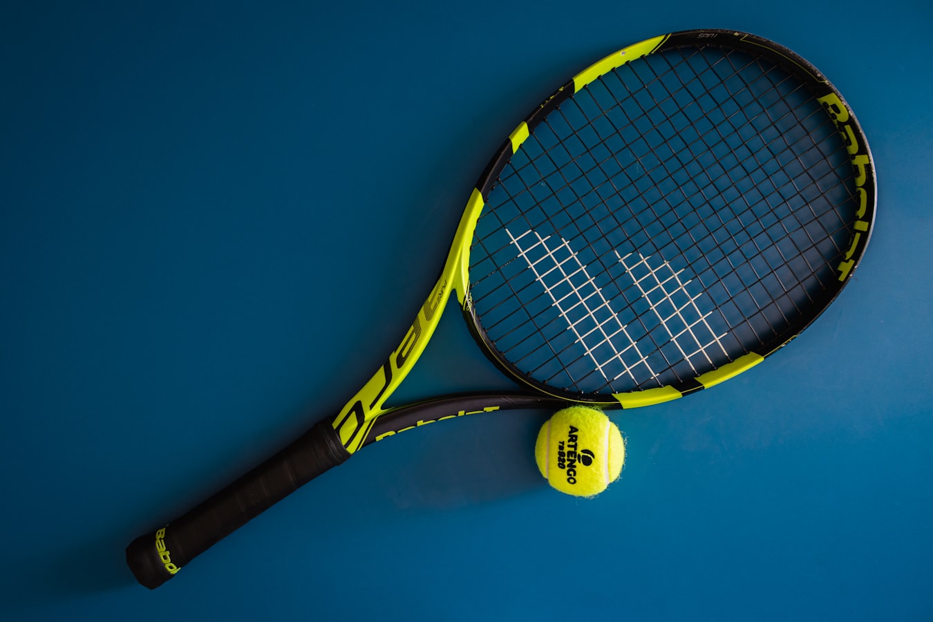 Tennis player mid-action on court